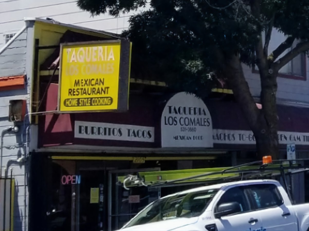 Taqueria Los Comales storefront on MacArthur Blvd in Oakland, with its yellow Mexican Restaurant sign